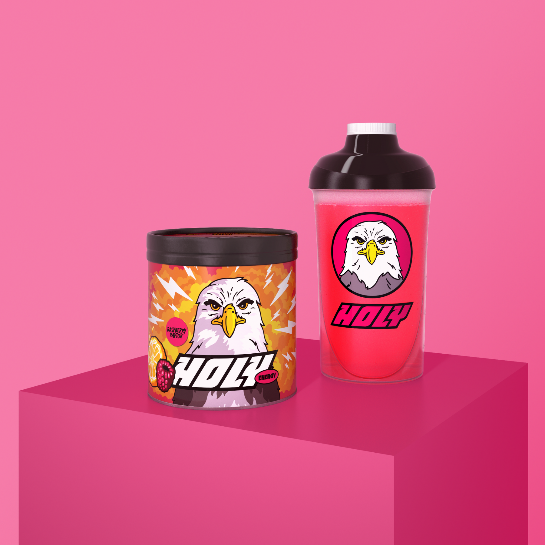 Pappdose und Shaker mit Adler-Design auf pinkem Hintergrund.